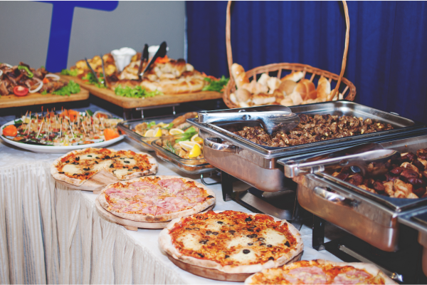Home catering service with fresh dishes arranged for guests