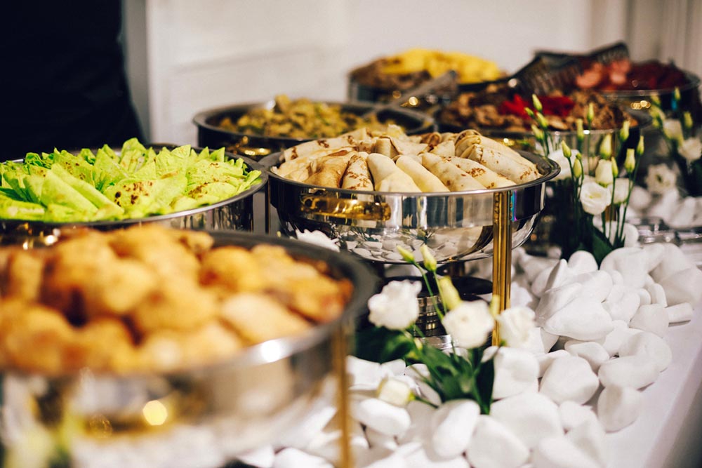 Meal prep containers filled with fresh ready to serve food